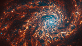 Webb Telescopes view face-on of spiral galaxy NGC 4254..webp