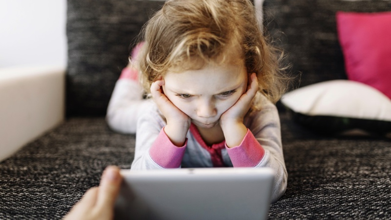 thoughtful-girl-watching-video-tablet.jpg