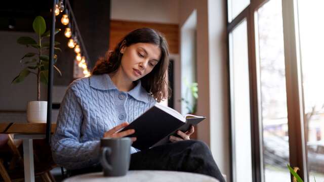 person-cafe-reading-book-while-having-coffee.jpg